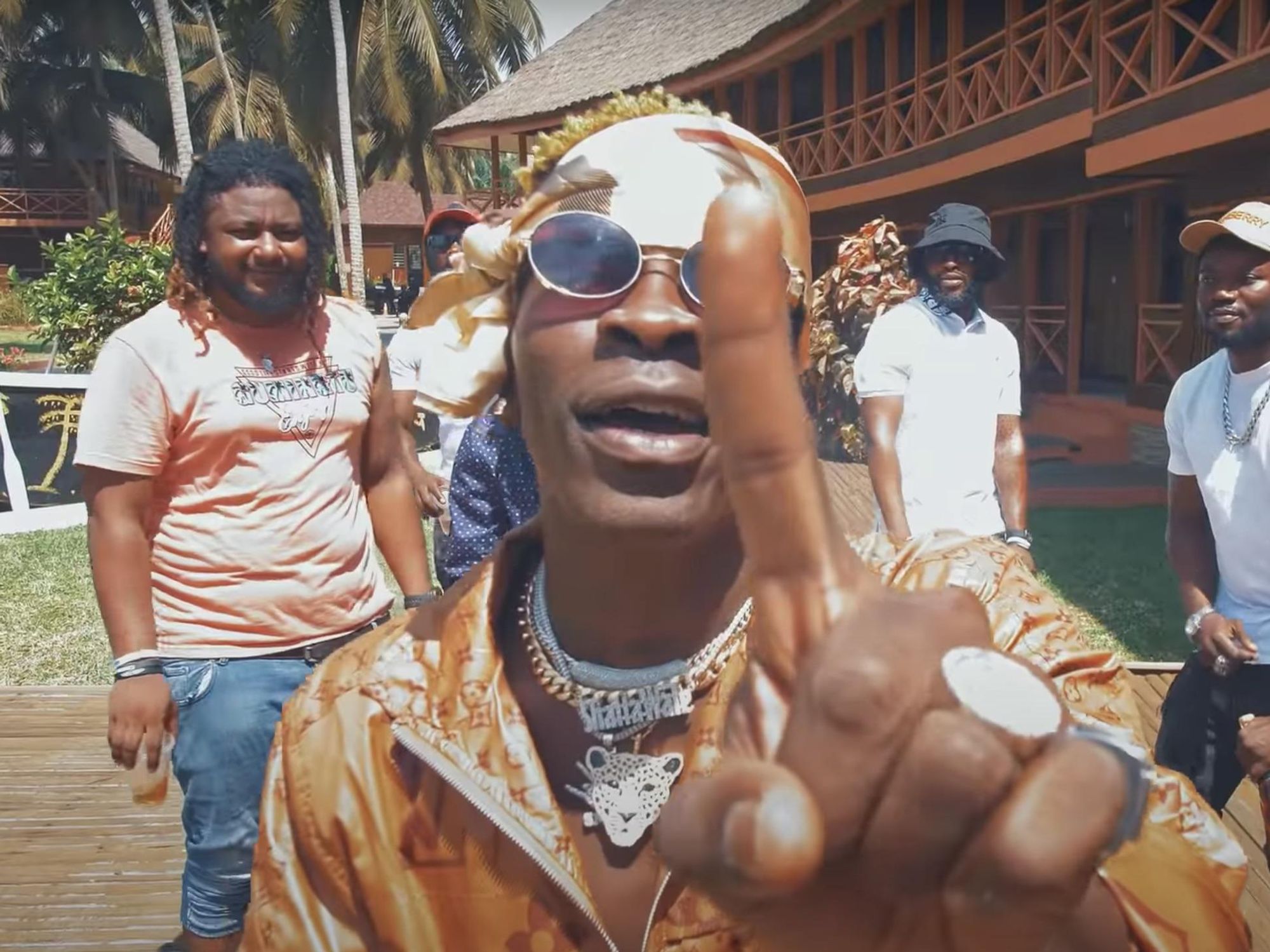 ​Shatta Wale lifts his index finger up in a screen grab from his "1 Don" music video.
