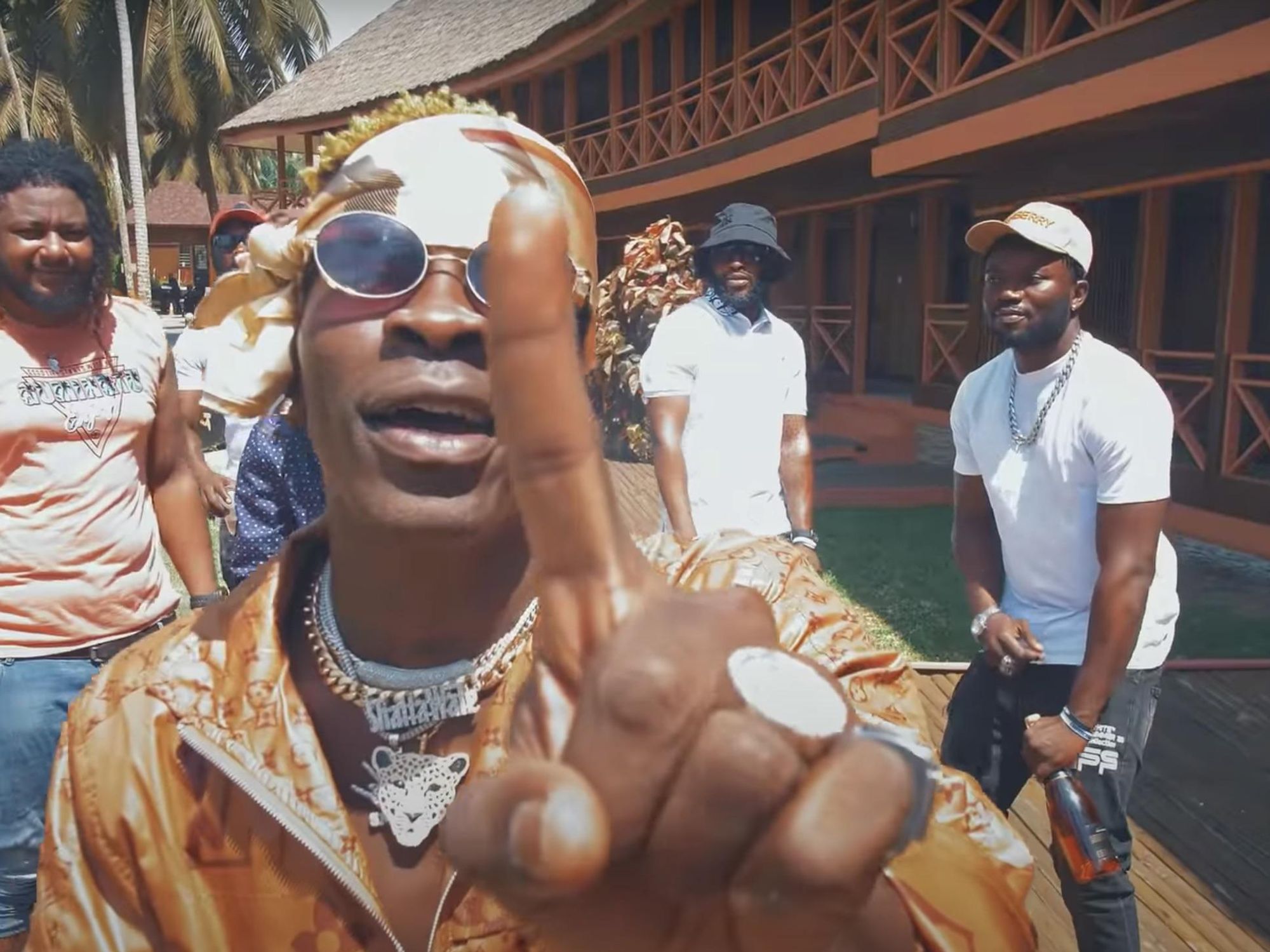 ​Shatta Wale lifts his index finger up in a screen grab from his "1 Don" music video.