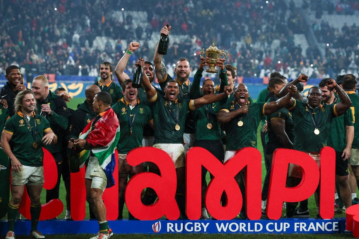South Africa players and staff celebrate with the Webb Ellis Cup after winning the Rugby World Cup France 2023 Gold Final match between New Zealand and South Africa at Stade de France on October 28, 2023 in Paris, France. 