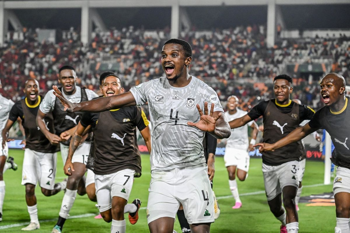 South Africa's midfielder #4 Teboho Mokoena (C) celebrates with teammates after scoring a goal during the Africa Cup of Nations (CAN) 2024 round of 16 football match between Morocco and South Africa at the Stade Laurent Pokou in San Pedro on January 30, 2024. 