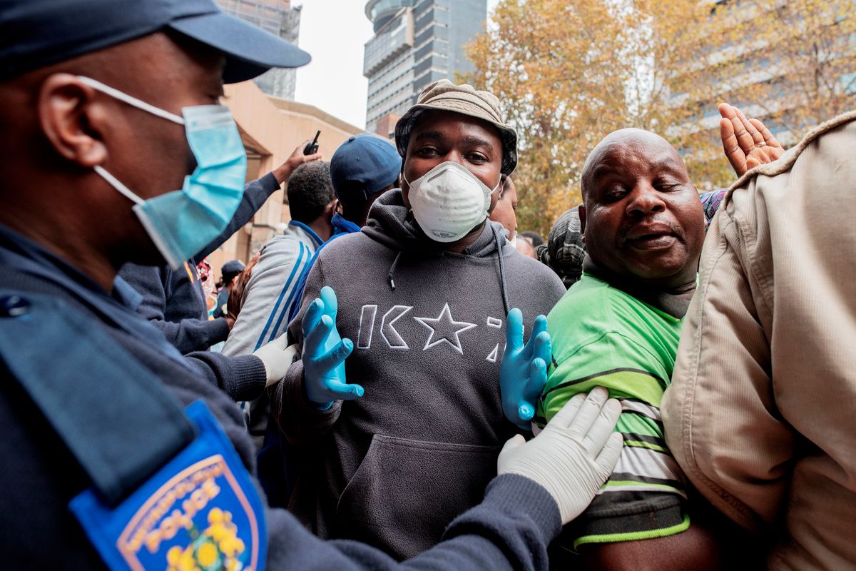 South African vendors pushed back by police in Johannesburg during coronavirus national lockdown