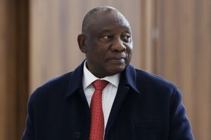 South Africa's President Cyril Ramaphosa wearing a blue wool trench coat, white shirt and a red tie at the BRICS summit in Kazan on October 23, 2024.