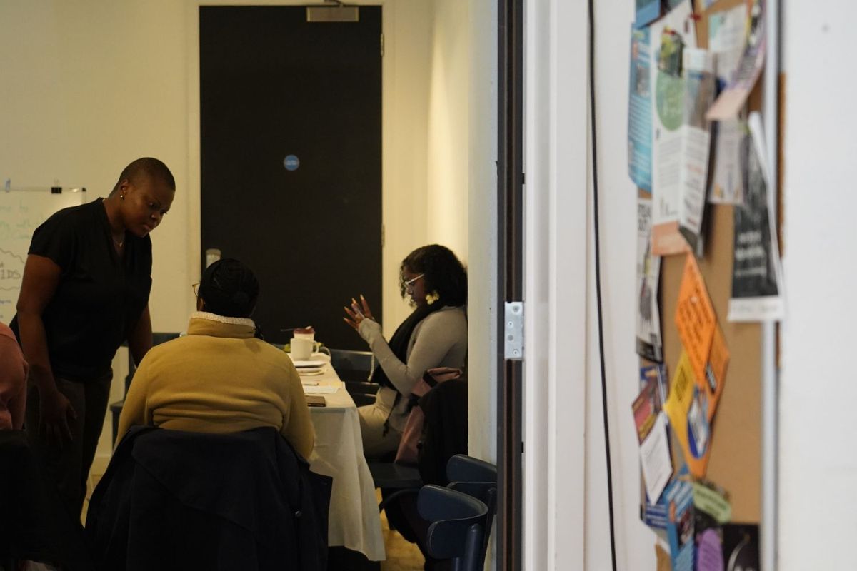 Stephanie Chisom Ozuo discusses with one of the participants at a careers workshop.