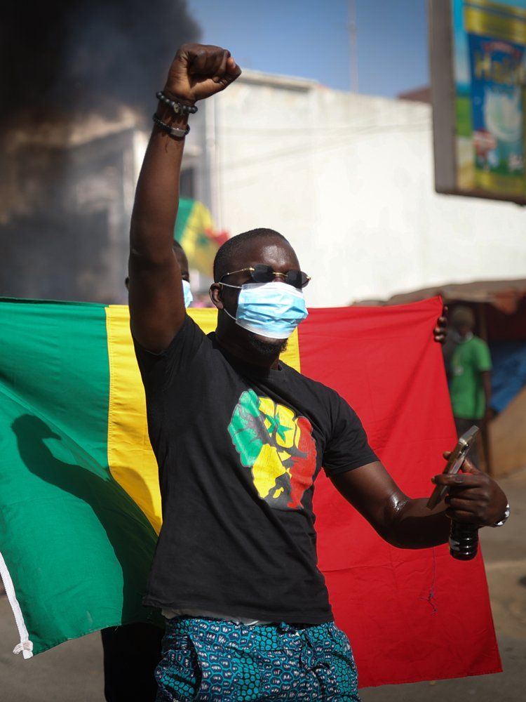 Supporters of opposition presidential candidates gather at the Saint-Lazare intersection to continue their campaign following the indefinite postponement of Senegal's Feb. 25 presidential election in Dakar, Senegal on February 4, 2024.