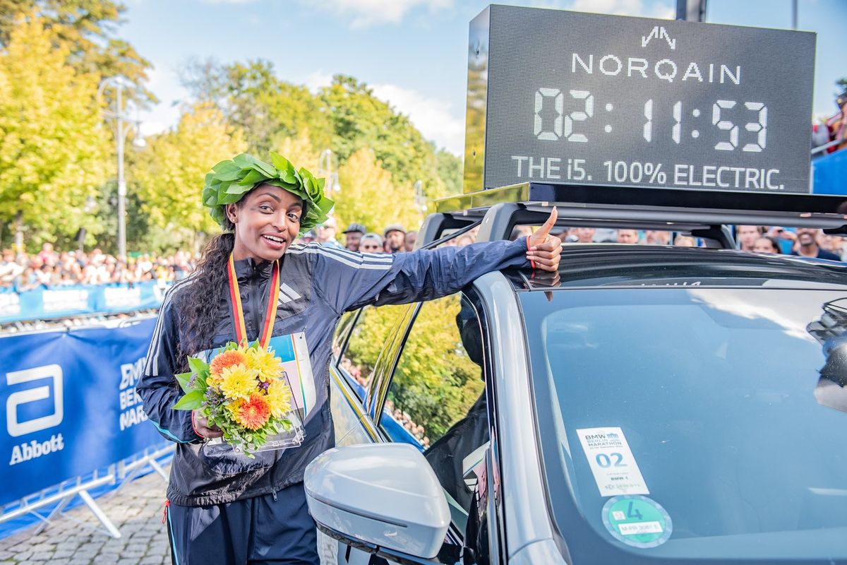 Tigist Assefa from Ethiopia celebrates the win with the new world record of 2 hours, 11 minutes and 53 seconds during the 2023 BMW Berlin-Marathon on September 24, 2023 in Berlin, Germany. 
