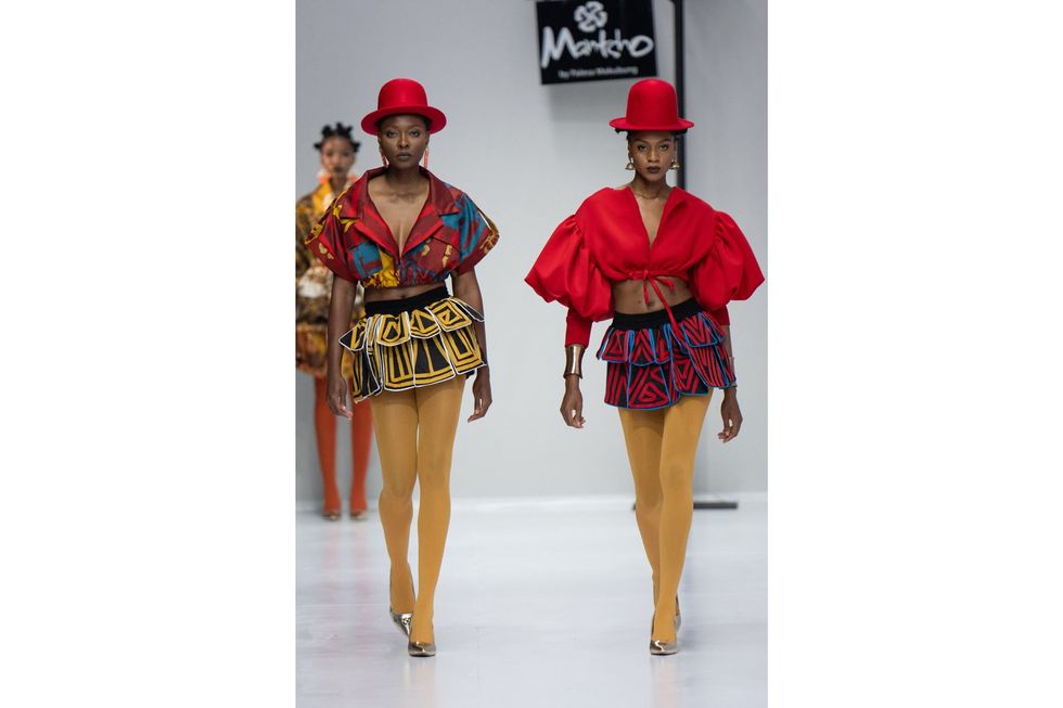 Two models wearing Mantsho at the South African Fashion AW24 show in Johannesburg, South Africa.