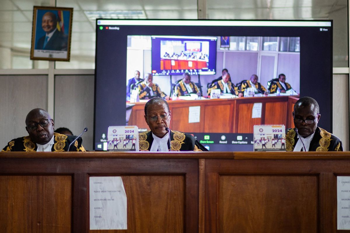 Uganda's deputy chief justice and head of the court Richard Buteera (C) delivers a judgment on the consolidated petitions challenging the constitutionality of the Anti-Homosexuality Act in Kampala on April 3, 2024.