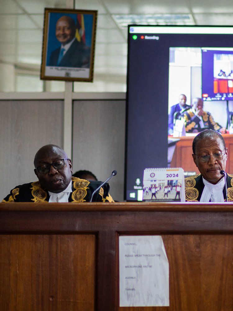 Uganda's deputy chief justice and head of the court Richard Buteera (C) delivers a judgment on the consolidated petitions challenging the constitutionality of the Anti-Homosexuality Act in Kampala on April 3, 2024.
