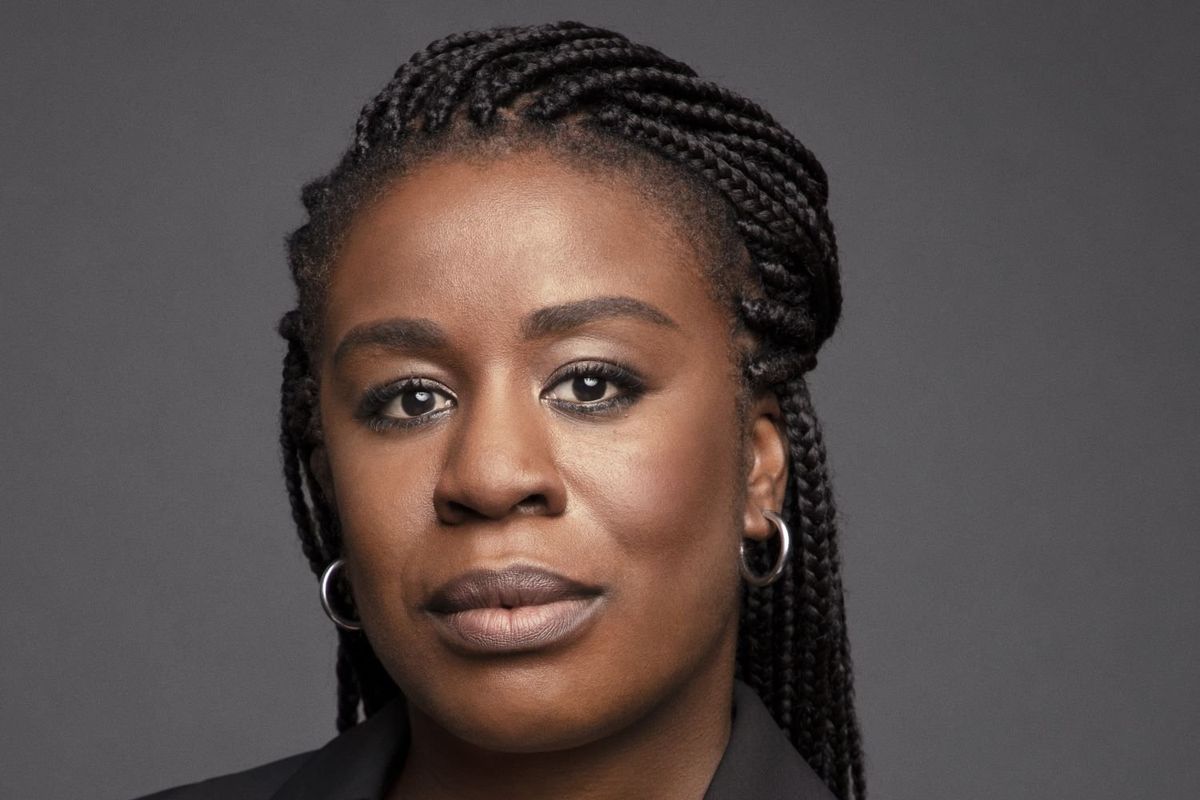 Uzo Aduba looks straight towards the camera with a slight smile on her face.