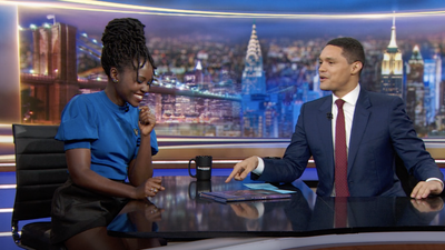  Lupita Nyong'o blue dress and Trevor Noah with suit