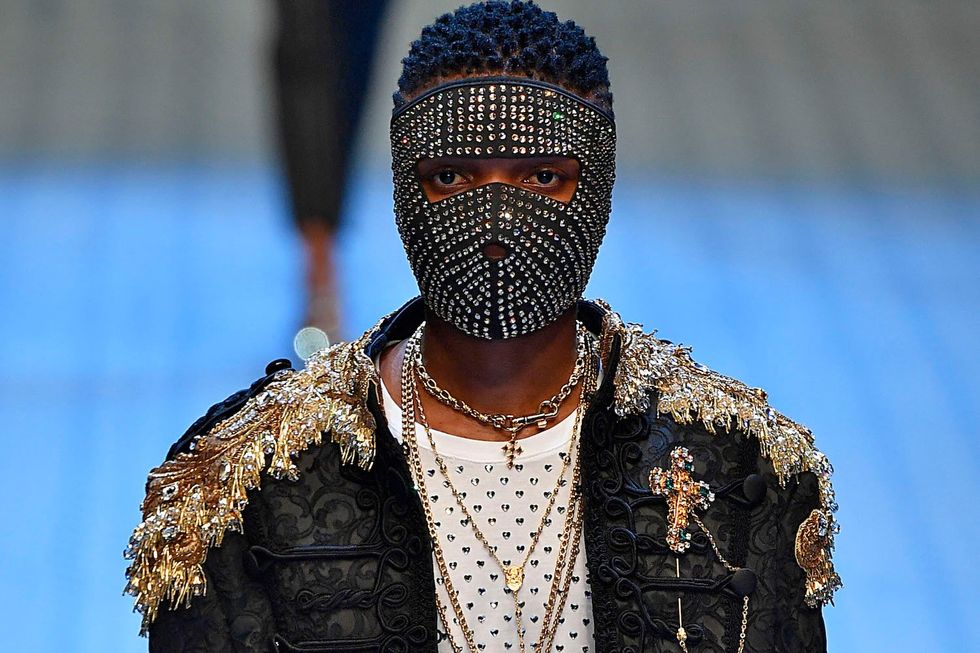 Wizkid walks the runway at the Dolce & Gabbana show during Milan Men's Fashion Week Spring/Summer 2019 on June 16, 2018 in Milan, Italy. 