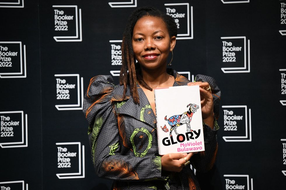 Zimbabwean author NoViolet Bulawayo holds her book 'Glory' during a photocall at the Shaw Theatre in King's Cross in London on October 14, 2022, ahead of Monday's announcement of the winner of the 2022 Booker Prize for Fiction.